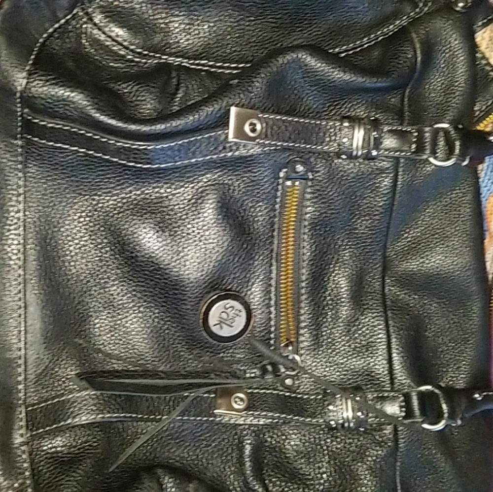 Used THE SAK purse. In style mom bag